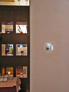 Wall mounted Futronix switch panel near niches